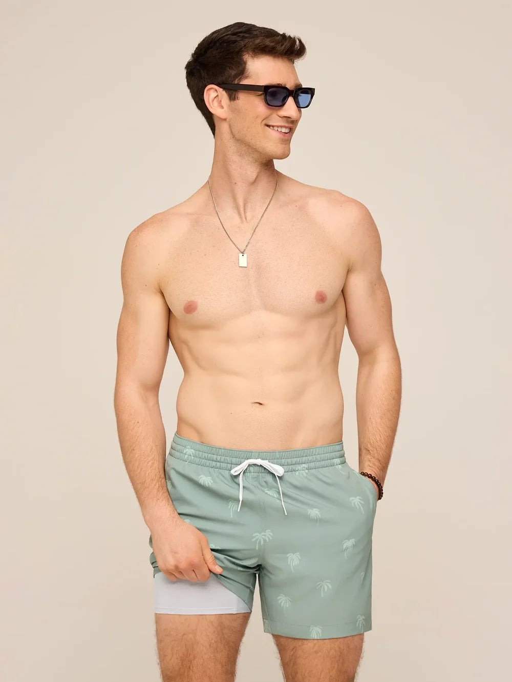 The Midnight Palms 5.5" Classic Lined Swim Trunk - Olive - Image 1 - Chubbies Shorts